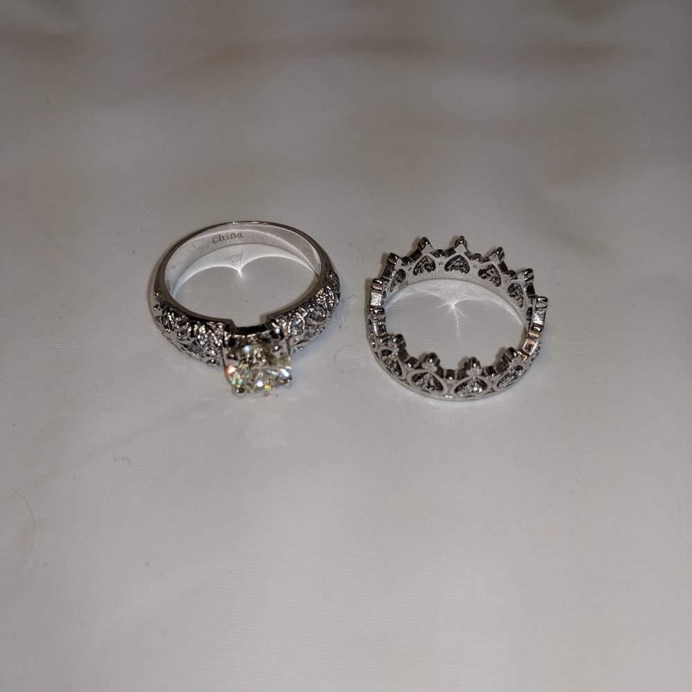 Two silver princess rings